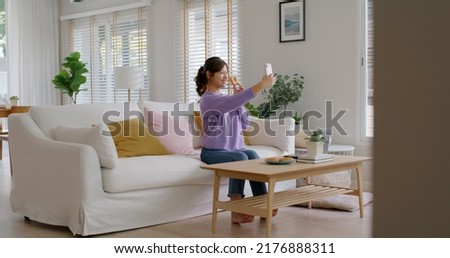 Similar – Image, Stock Photo Smiley girl playing video games at night