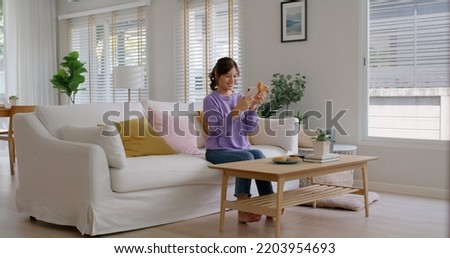 Similar – Image, Stock Photo Smiley girl playing video games at night