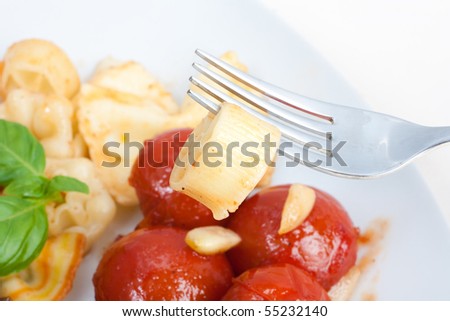 Fork with pasta on food
