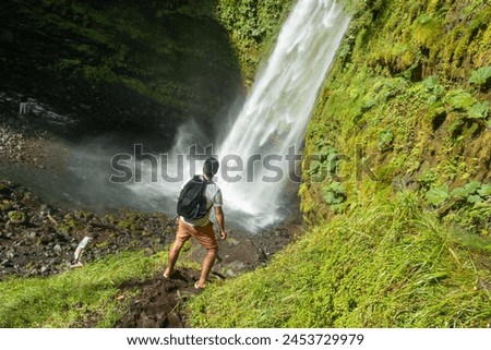 Similar – Image, Stock Photo Traveling man near waterfall in mountains