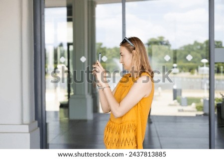 Similar – Image, Stock Photo Female tourist taking shot of sea in twilight