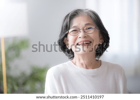 Image, Stock Photo Smiling senior woman at home looking at camera