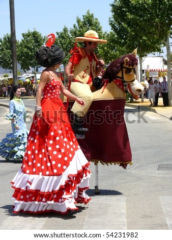 CORDOBA - MAY 29: Long-legged fancy dressed people at Cordoba festival. May 29, 2010 in Cordoba, Spain