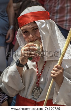 CORDOBA - APR 17 - Unidentified boy plays the role of hebrew at Palm Procession (Palm Sunday) on April 17, 2011 in Cordoba, Spain.