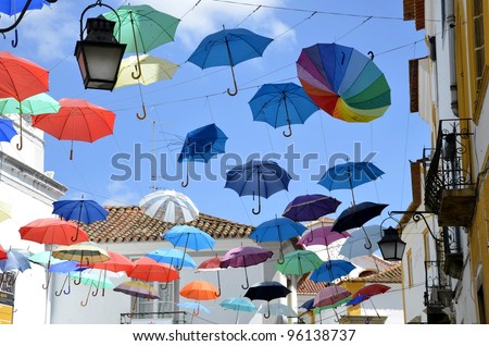 Street decorated with colored umbrellas. Evora. Portugal.