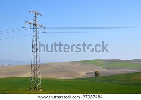 Power line in a wheat field. Cordoba. Spain.