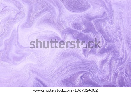 Abstract fluid art background light purple and lilac colors. Liquid marble. Acrylic painting on canvas with violet shiny gradient. Alcohol ink backdrop with pearl wavy pattern.