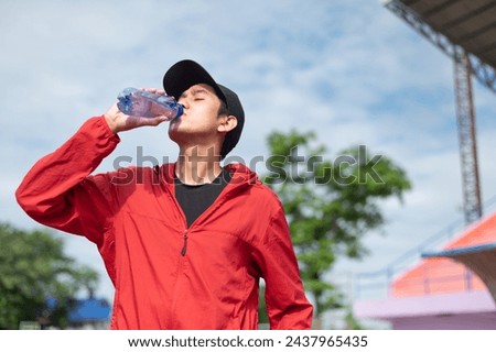 Similar – Image, Stock Photo Slim sportswoman drinking water in park