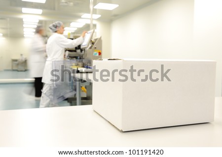 Crate in front of medical staff in modern factory