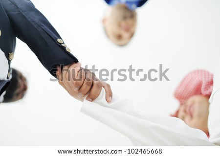 Closeup of business people shaking hands over a deal somewhere in the Middle east