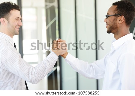 Successful business people hand shaking after great deal