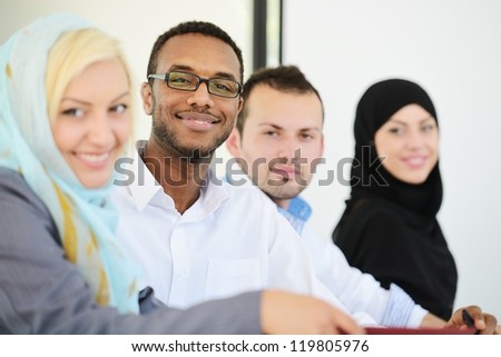 Arabic business people sitting in a row at office (selective focus)