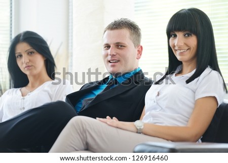 Portrait of satisfied business partners laughing during conversation