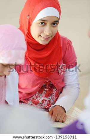 Muslim and Arabic girls learning together in group