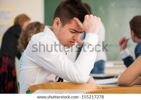 Sad Student Sitting In A Classroom Stock Photo 155217278 : Shutterstock