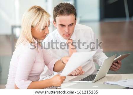 Two business people at work in an office