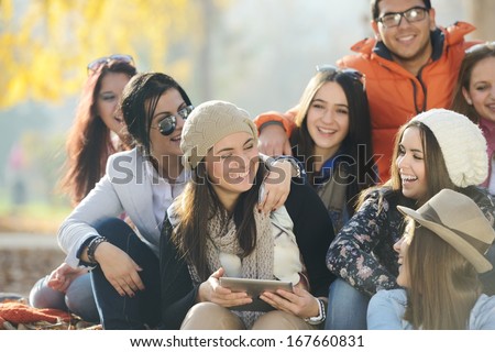 Happy teen girls having good fun time outdoors