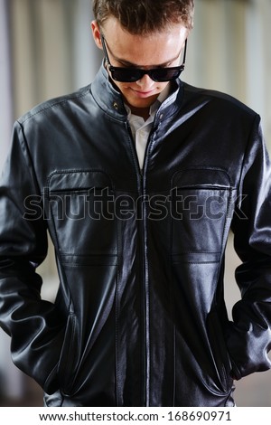 Handsome young man in leather jacket