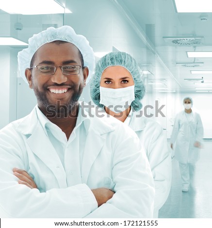 Team of scientists at modern hospital lab