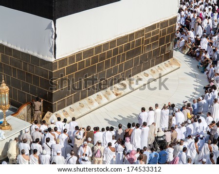 MECCA, SAUDI ARABIA - OCTOBER 13: Muslim pilgrims, from all around the World, revolving around the Kaaba on October 13, 2013 in Mecca, Saudi Arabia.