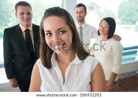 Handsome business woman posing portrait in office