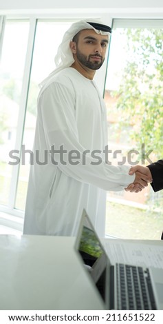 Young Arabic business man hand shaking for new contract