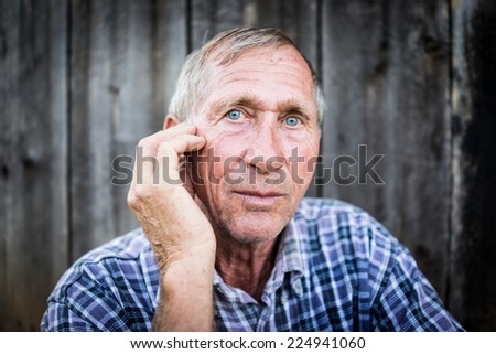Desperate senior man suffering and covering face with hands in deep depression, pain, emotional disorder, grief and desperation concept