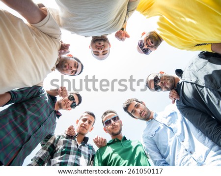 Happy young people in circle