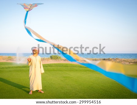 Happy Arabic kid with kite