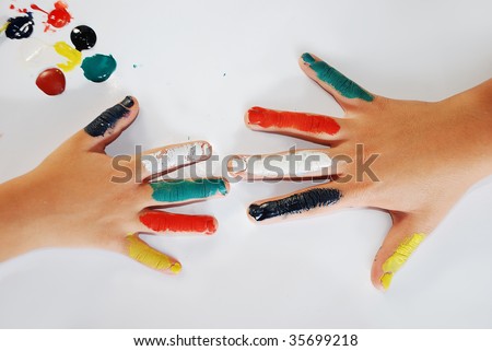 Children little hands playing with colors on white background