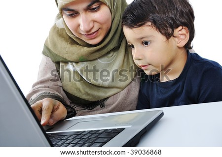Muslim woman and her son on laptop