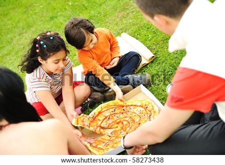 Eating pizza, picnic, family outdoor