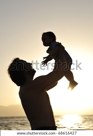 Father and son on the Beach - Silhouette Shot