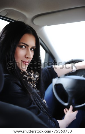 Woman Sitting In Car And Driving, rear view angle