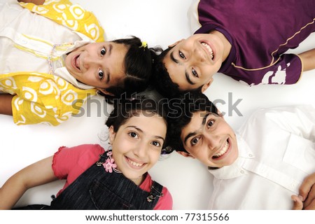 Horizontal  photo of four children group,  friends smiling isolated on white, boys and girls closeup