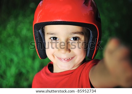 Little kid with biking safety helmet portrait