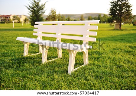 Similar – Image, Stock Photo White plastic garden bench stands on a meadow with yellow flowers