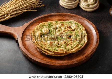 Similar – Image, Stock Photo Indian flatbreads on a blue background, above view. Homemade naan bread