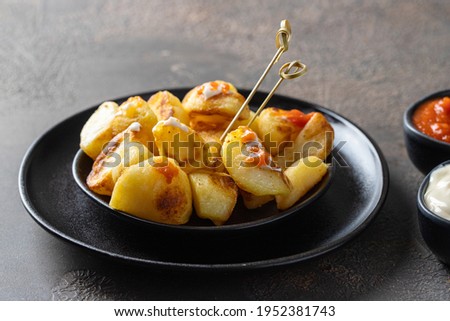 Similar – Image, Stock Photo Patatas bravas traditional Spanish potatoes snack tapas