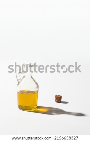 Extra virgin olive oil bottle on white background with shadow. Healthy mediterranean condiment. Stock foto © 