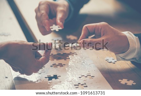 Implement puzzle improve communication solve synergy organize team building connection plan trust service strategy. Stakeholders business trusted communicate teams hands holding jigsaw puzzle synergy Сток-фото © 