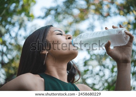 Similar – Image, Stock Photo Traveling woman drinking water from river