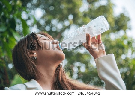 Image, Stock Photo Traveling woman drinking water from river