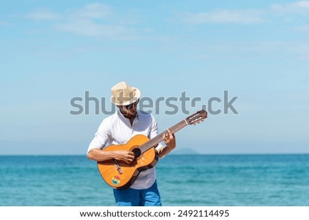 Similar – Image, Stock Photo Cheerful man playing ukulele guitar