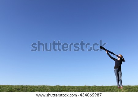 Similar – Image, Stock Photo teenager looks through a magnifying glass and pulls up her nostrils