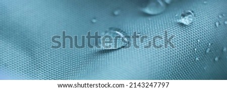 waterproof fabric with waterdrops. non woven fabric water texture background Water drops on waterproof nylon fabric. soft focus Stockfoto © 