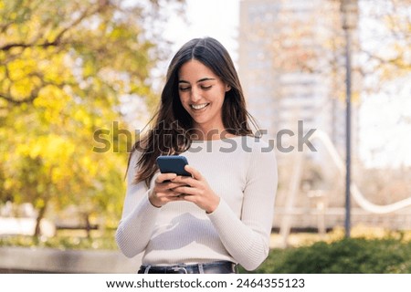 Image, Stock Photo happy caucasian woman at home doing video call with friends on mobile phone. Home office and friendship