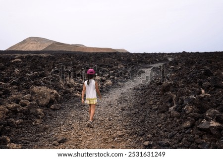 Image, Stock Photo Unrecognizable traveler between rough mountain and foamy sea