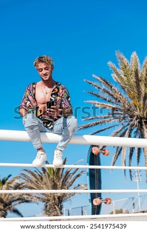 Similar – Image, Stock Photo Carefree male skater browsing cellphone in city