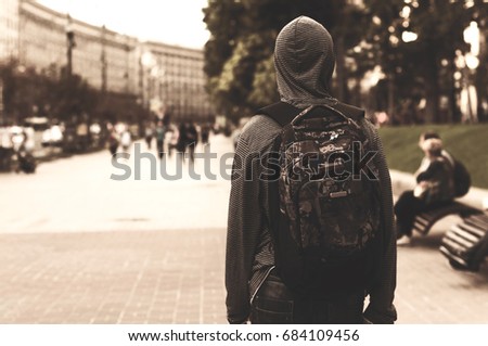 Similar – Dreamy modern man walking along city street